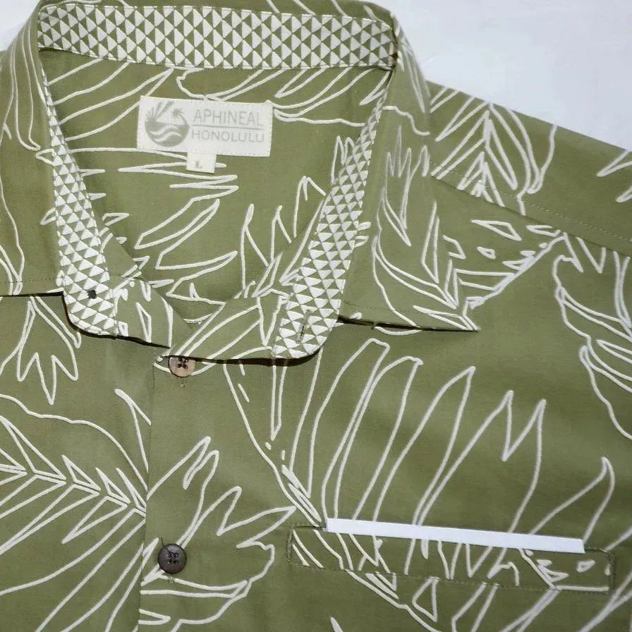 man's green Hawaiian aloha shirt with closeup of collar and pocket.